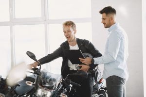 Handsome man choosing a motorcycle to buy